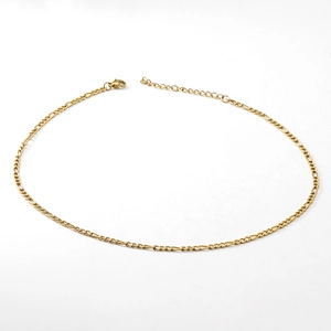 Detailed view of an 18K gold-plated stainless steel Figaro chain necklace with lobster clasp