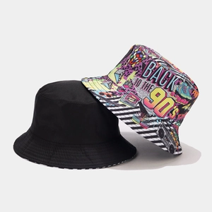 Reversible 90s retro graffiti bucket hat featuring black solid color and colorful patterns