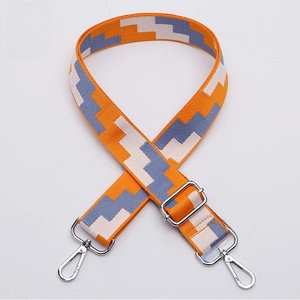 Detail of adjustable wide shoulder strap with orange and blue geometric patterns
