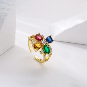 Adjustable gold plated ring with colorful pear cut zircons on white geometric stones