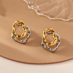 Minimalist lava texture two-tone irregular hoop earrings in gold and silver finish