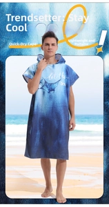 Deep blue gradient microfiber hooded beach poncho featuring manta ray print and let the sea text
