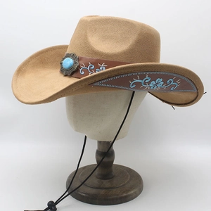 Detail of camel cowboy hat featuring turquoise buckle and blue floral embroidery