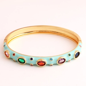 Detailed close-up of sky blue enamel gold bracelet with colorful zircon gemstone inlays