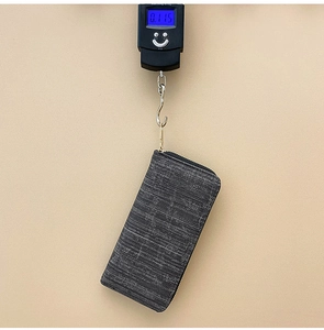 Detailed view of dark grey striped wallet showing lightweight design of 0.115kg