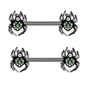 Détail d'un bijou de piercing araignée en acier noir avec cristaux verts et blancs