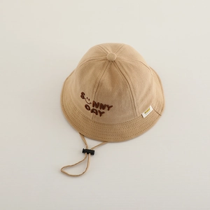 Detail of khaki kids bucket hat featuring SUNNY DAY embroidery and adjustable wind string