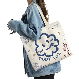 Large canvas tote bag with blue cartoon doodle prints for daily office commuting