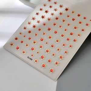 3D golden star nail art stickers with red gemstone centers for French manicure designs