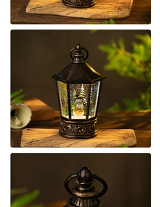 Close-up of vintage bronze Christmas snow globe lantern featuring a snowman and trees