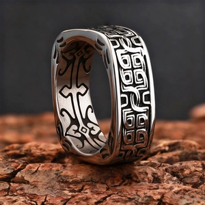 Mens square vintage ring with Celtic pattern on textured tree bark background