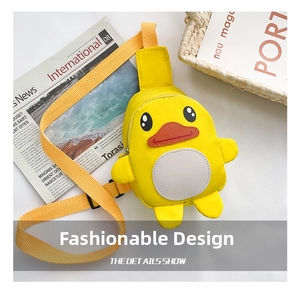 Detailed close-up of a yellow cartoon duck crossbody bag for kids with 3D wings and soft strap