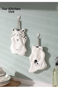 Detailed embroidery of cat face and bell on a white hanging coral fleece towel