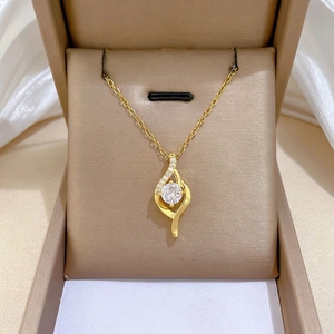 Minimalist gold plated titanium steel necklace with flame pendant in a luxury jewelry box