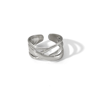 Close-up of silver layered crossover adjustable stainless steel ring with hammered texture