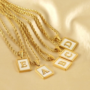 Square gold initial pendants with white enamel on twist chains, A to E letter charms