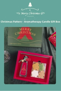 Detailed view of Christmas aromatherapy set with red and green candles and scented oil