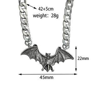 Detailed view of silver bat pendant with dimensions 22mm by 45mm on a cuban chain