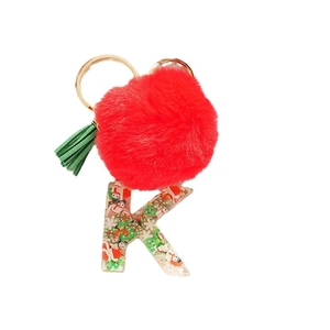 Christmas alphabet K keychain with red pompom and miniature holiday decor inside