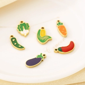 Detail of 6 colorful enamel vegetable pendants including carrot and corn for DIY jewelry