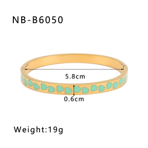 Detail view of 18K gold plated bangle with green enamel hearts including dimensions