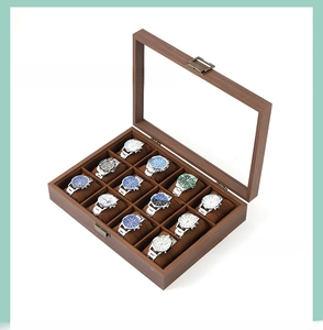 Detail of 12-slot wooden watch box with walnut finish and clear glass display window