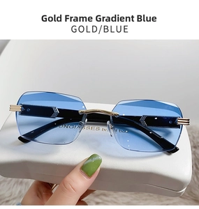 Detailed close-up of gold frame gradient blue rimless sunglasses with metal hinges