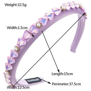 Sponge velvet headband with purple crystal hearts and pearls on white background