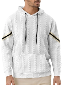 Detail of white hoodie featuring intricate cable knit texture and black-gold striped cuffs