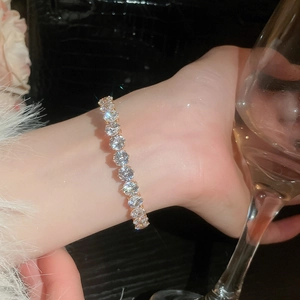 Elegant tennis bracelet with round sparkling cubic zirconia on a gold base wrist wear