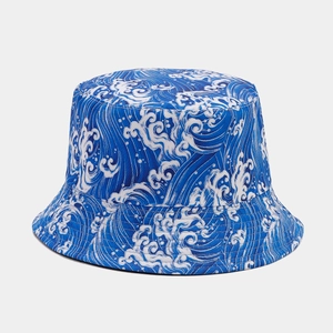 Detail of blue bucket hat featuring white Great Wave pattern and reinforced stitching
