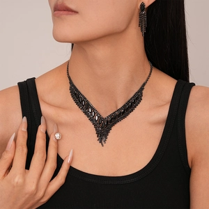 Elegant 2-piece set featuring black rhinestone V-shape necklace and tassel earrings