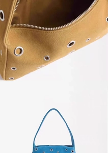 Detail of metal eyelet studs and zipper on yellow and blue suede shoulder bags