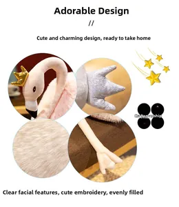 Detailed close-up showing gold crown embroidery and sequin wings on a white swan plush toy