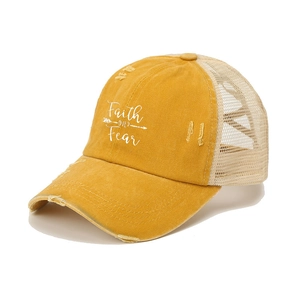 Distressed mustard yellow trucker hat with Faith Over Fear print and mesh back