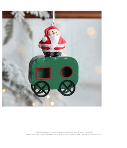 Close-up of Santa Claus on a green carriage ornament hanging on a Christmas tree