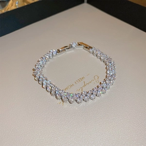 Close-up of triple-row silver-plated tennis bracelet with sparkling zircon stones