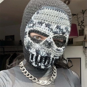 Detail of handmade crochet skull balaclava with intricate knit pattern and realistic design