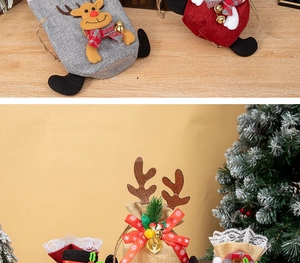 Macro detail of Christmas reindeer gift bag with 3D antlers and festive bell accents