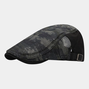 Detail view of the breathable mesh back and adjustable metal buckle on a camo ivy cap