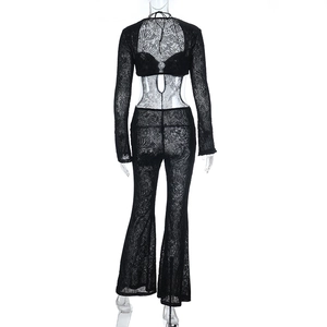 Detail view of the black lace flocked fabric and intricate botanical pattern on the back