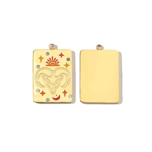 Detailed macro view showing both sides of a 14K gold Aries zodiac pendant with crystal stars