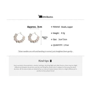 Detailed view of silver hoop earrings with irregular beads showing size and specifications