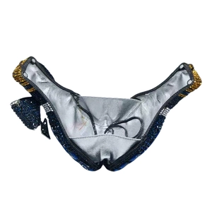Detail view of the crystal evening bag interior with silver lining and metal chain
