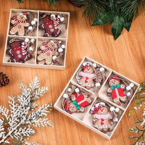 Gingerbread man Christmas ornaments set in wooden gift box with pine decorations