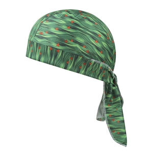 Detail of green durag featuring orange triangle patterns and wavy print fabric