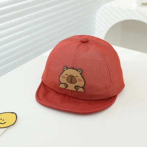 Detail of red toddler mesh cap featuring a cute brown cartoon capybara rubber patch
