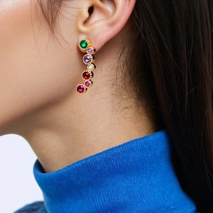 Elegant gold earrings with colorful zircon stones in a vibrant multi-color gradient design