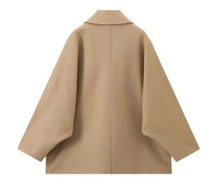 Detail view of the back seams and drop shoulder design of a warm camel wool jacket