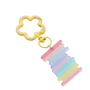 Colorful striped acrylic butterfly keychain with yellow flower clasp on white background